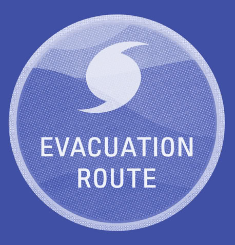 blue sign that reads evacuation route and has the hurricane spiral symbol.